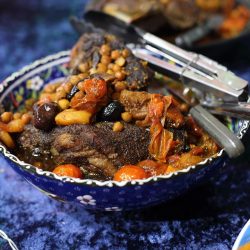 Lamb leg spiced with 'Res El Hanout' slow cooked with dried apricots and olives