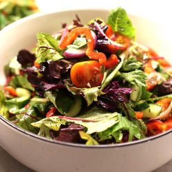 Fresh seasonal greens and vegetables with a tangy olive oil and lemon dressing